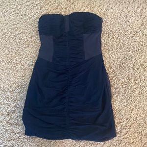 Navy form fitting dress, strapless, no rips snags or stains.